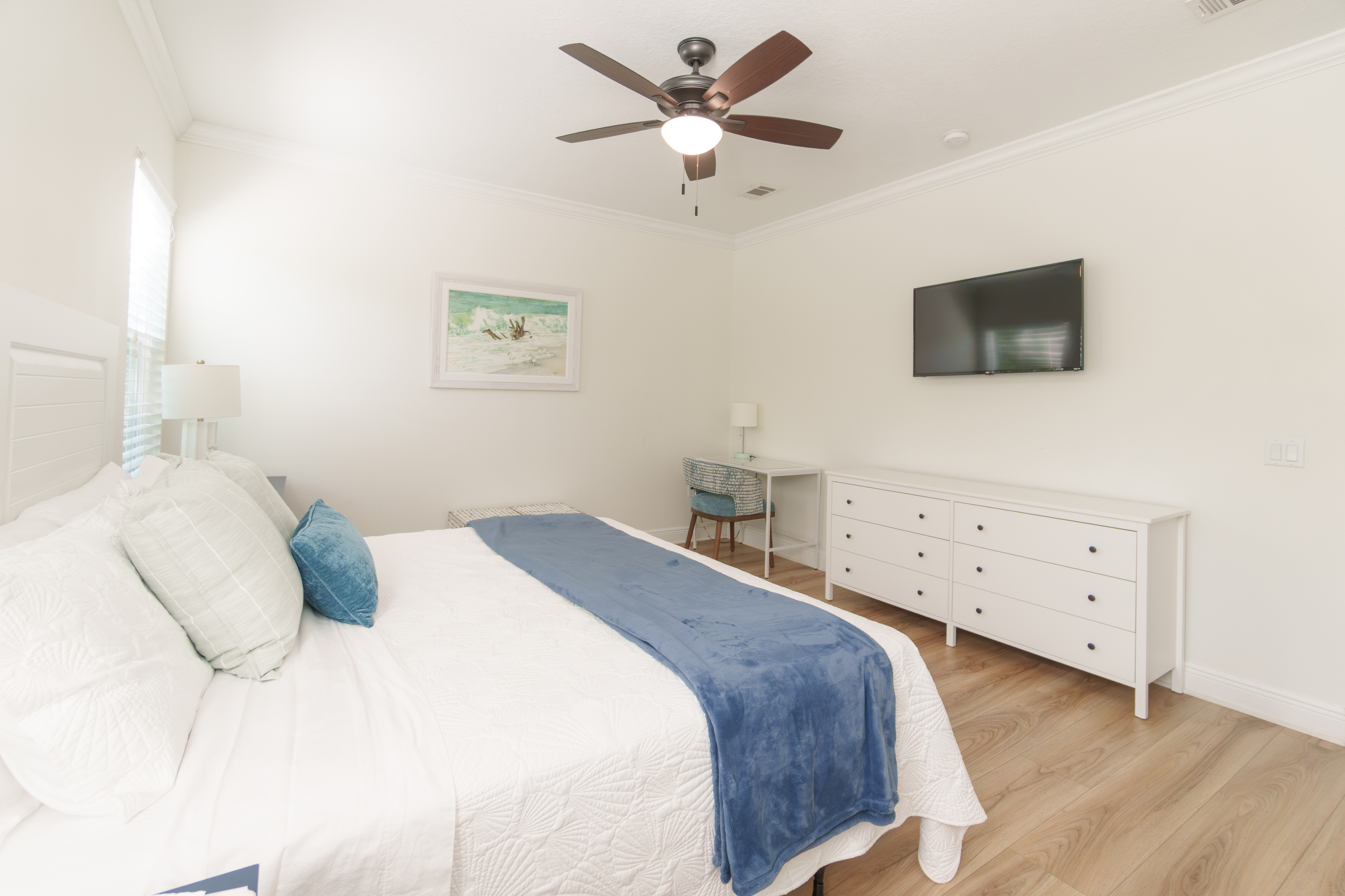 A TV, desk area, and plenty of storage, everything you need to settle in for a longer stay.