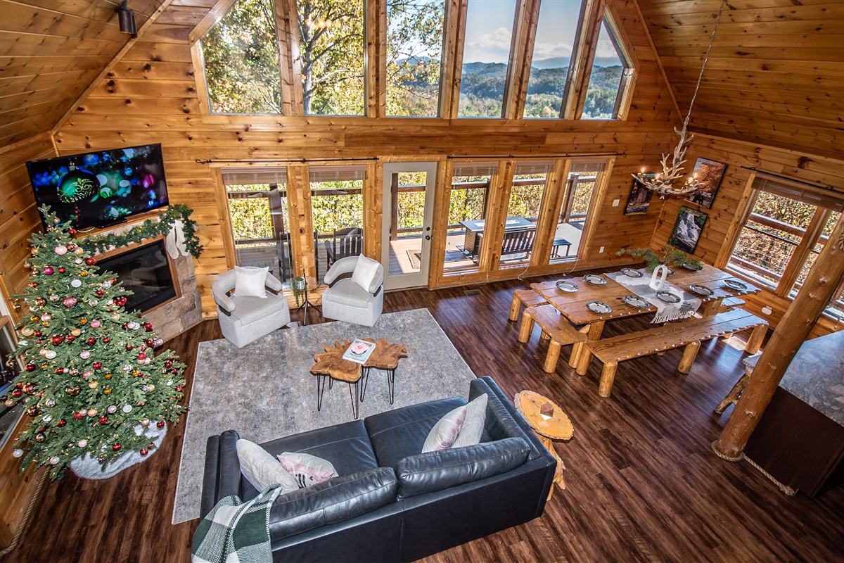 A spacious, open-concept, main level living space leaves plenty of room to gather as a group, relax and look out over the gorgeous Smoky Mountains.