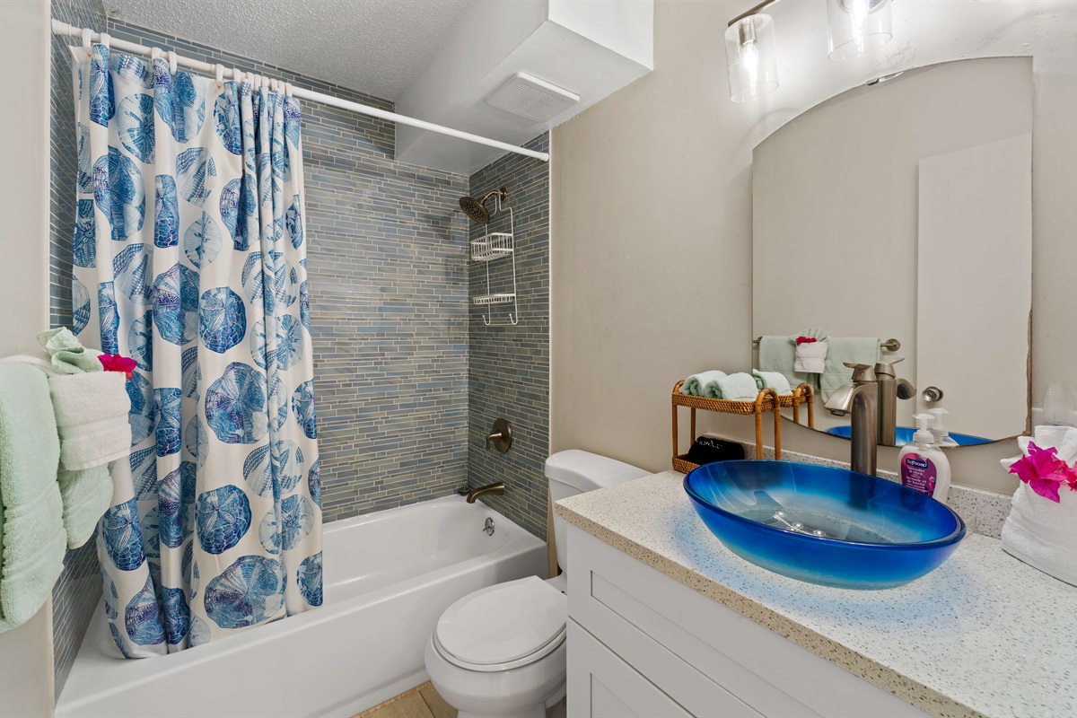 Primary bathroom offers a clean, bright room with modern comforts.