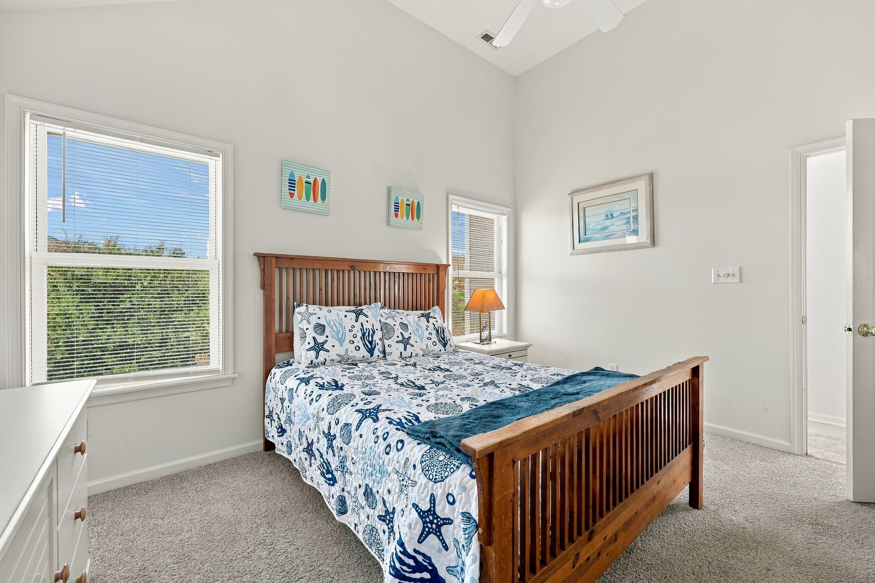 Windows on two sides and soaring ceilings keep this room light and airy.