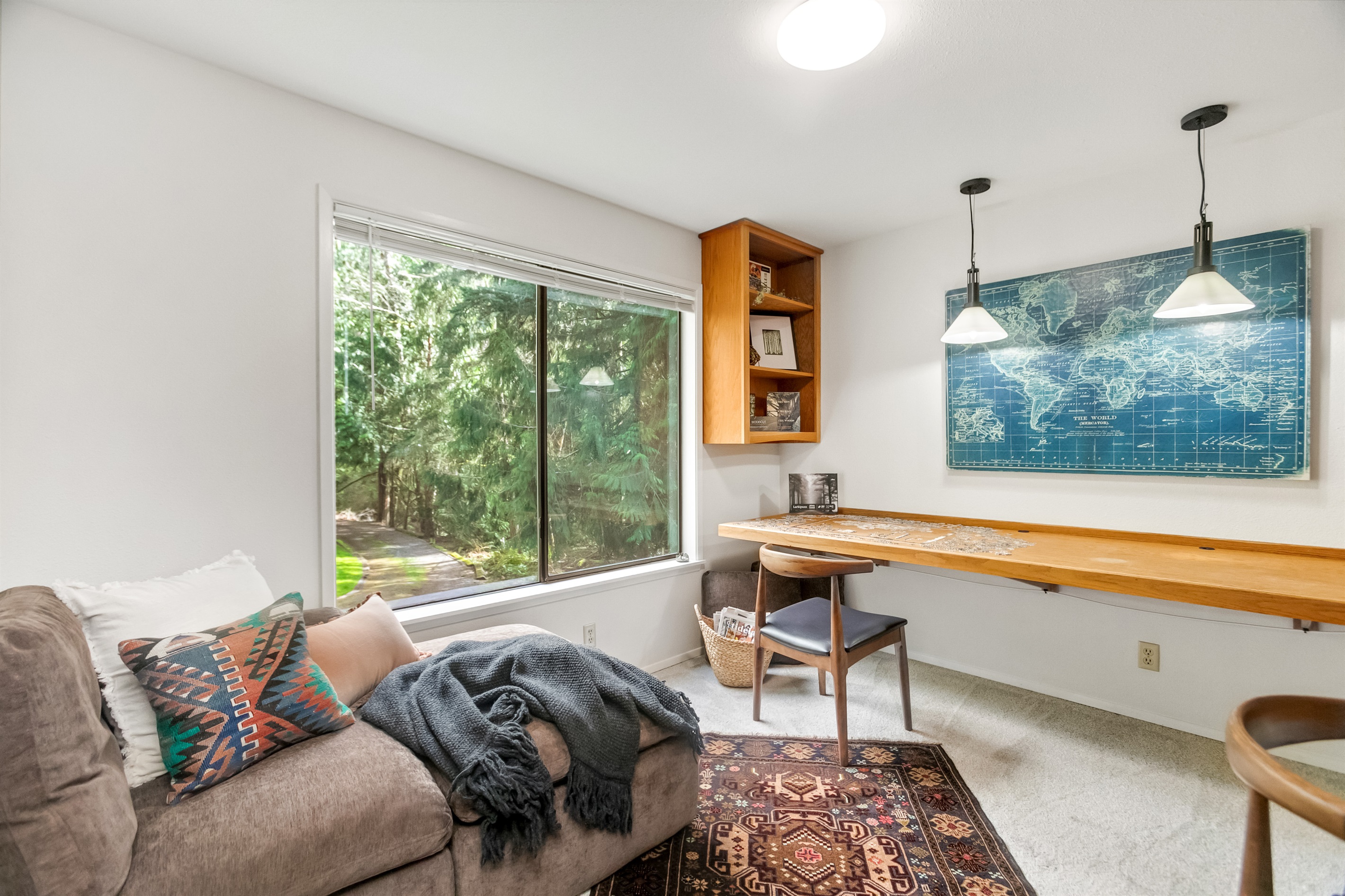Soak up the natural light and evergreen views while enjoying a book in the Shea Lounge in the library.