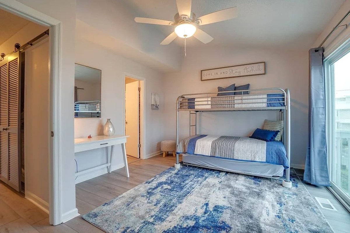 Watch the kids fight over the top bunk &mdash; twin-over-full with a trundle sleeps up to 3, and they'll feel like they have their own world in here.