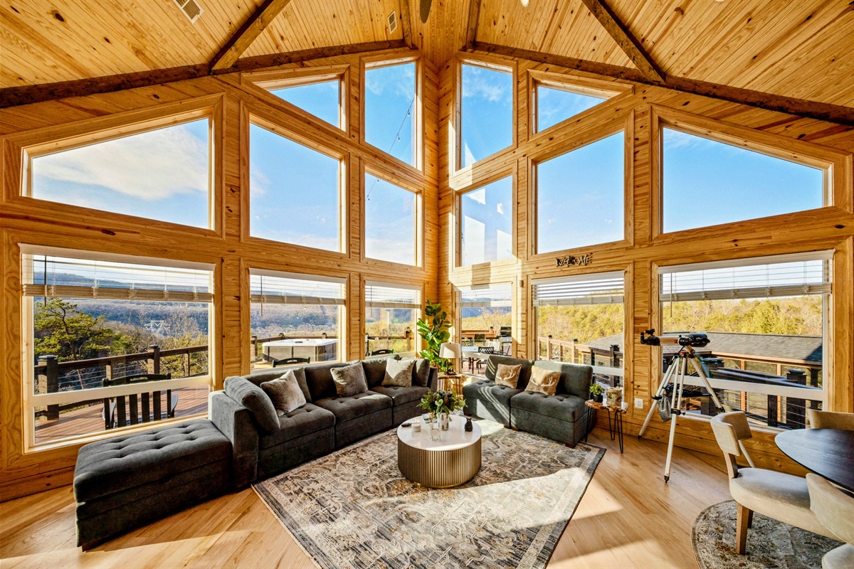 Grand Gathering Space – Towering windows flood the lodge’s great room with natural light and stunning mountain views, creating a warm, unforgettable place to relax and reconnect.