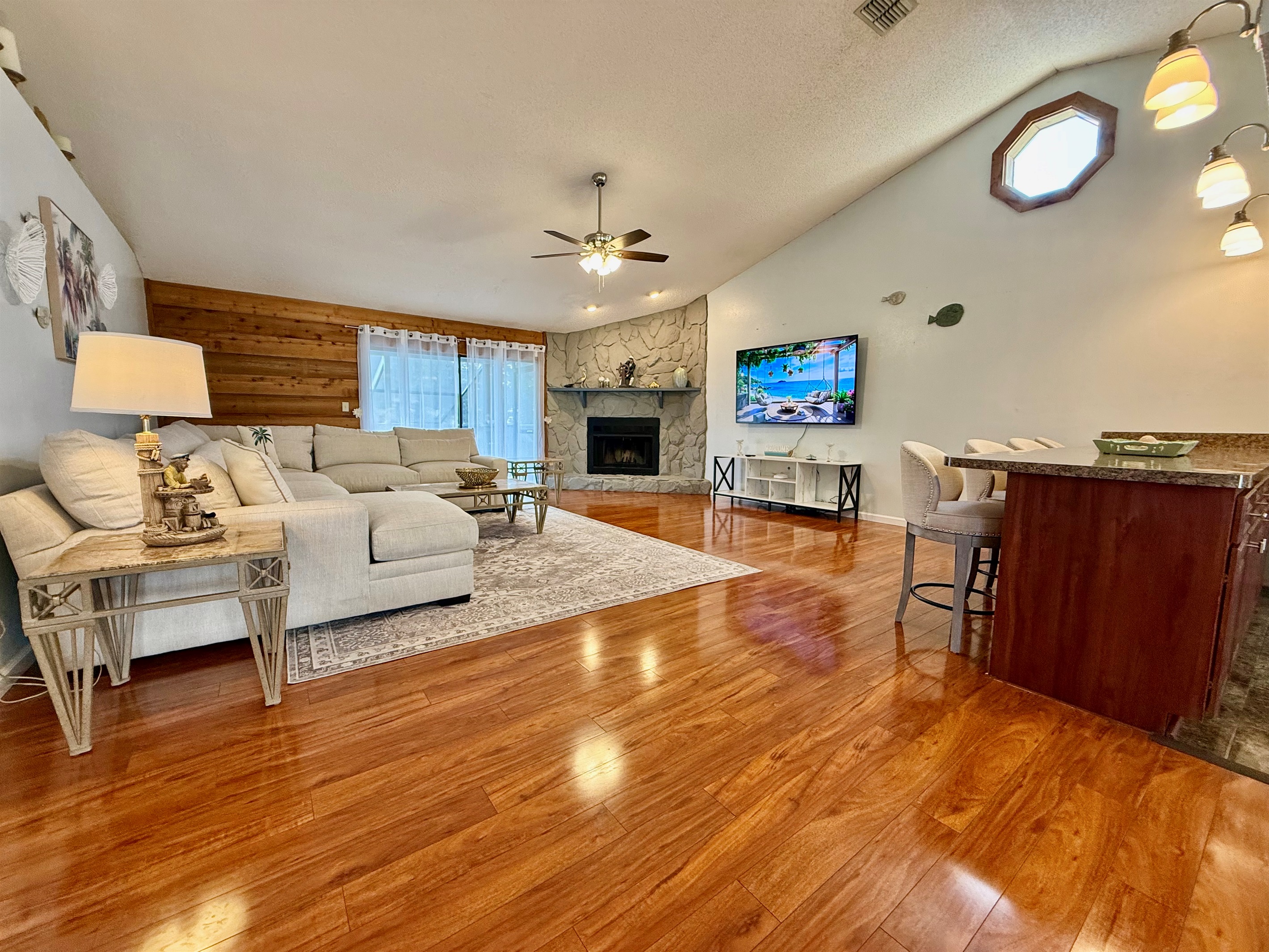 The star of the room is the light cream L-shaped sectional, spacious enough to stretch out solo or gather the whole group for a movie night.