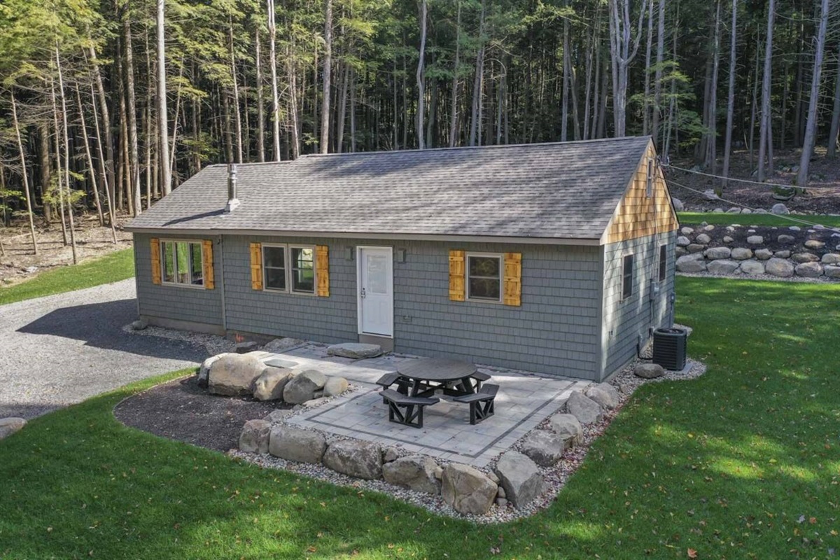 Front of House with Patio and 8 Person Table