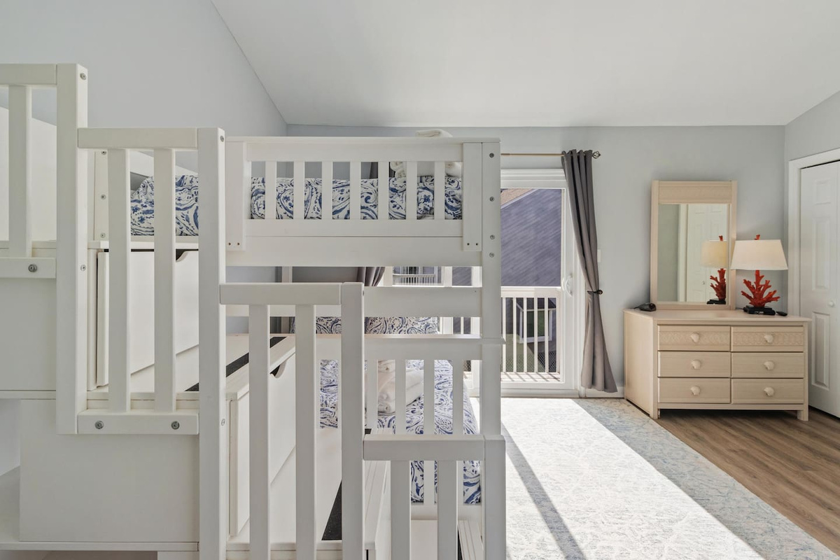 Step out to the bunk room's private balcony and check the Gulf from the second-floor vantage point.