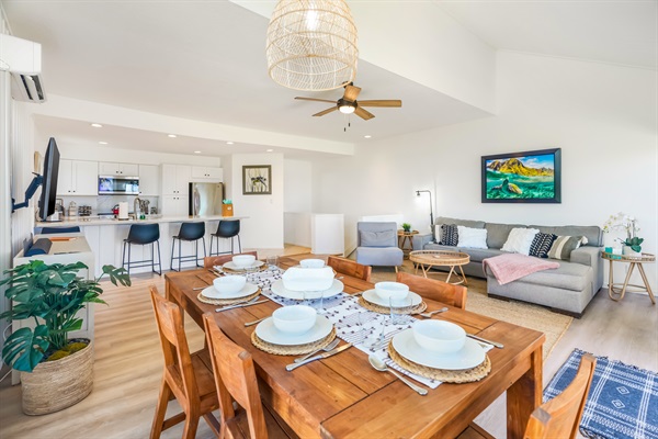 Open and airy living, dining, kitchen area with tall ceilings