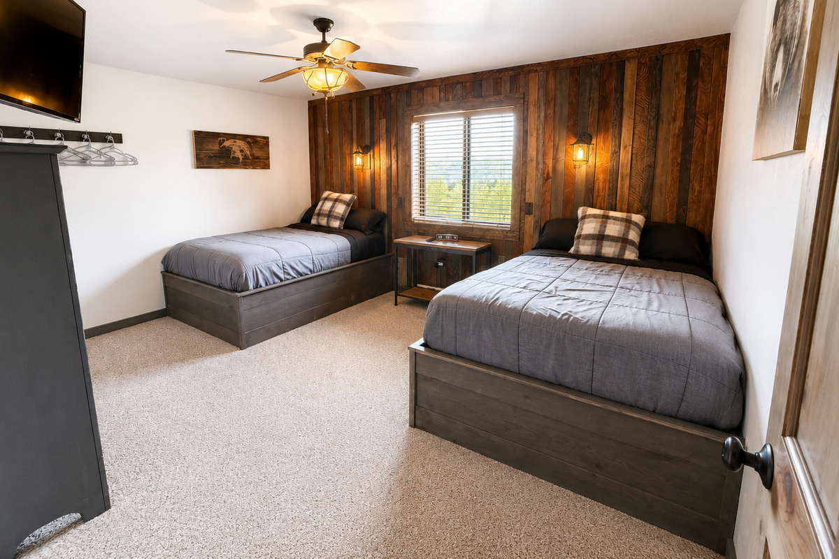 Spacious multi bed bedroom gives families and groups flexible sleeping accommodations with plenty of room to settle in and recharge between Northwoods adventures.