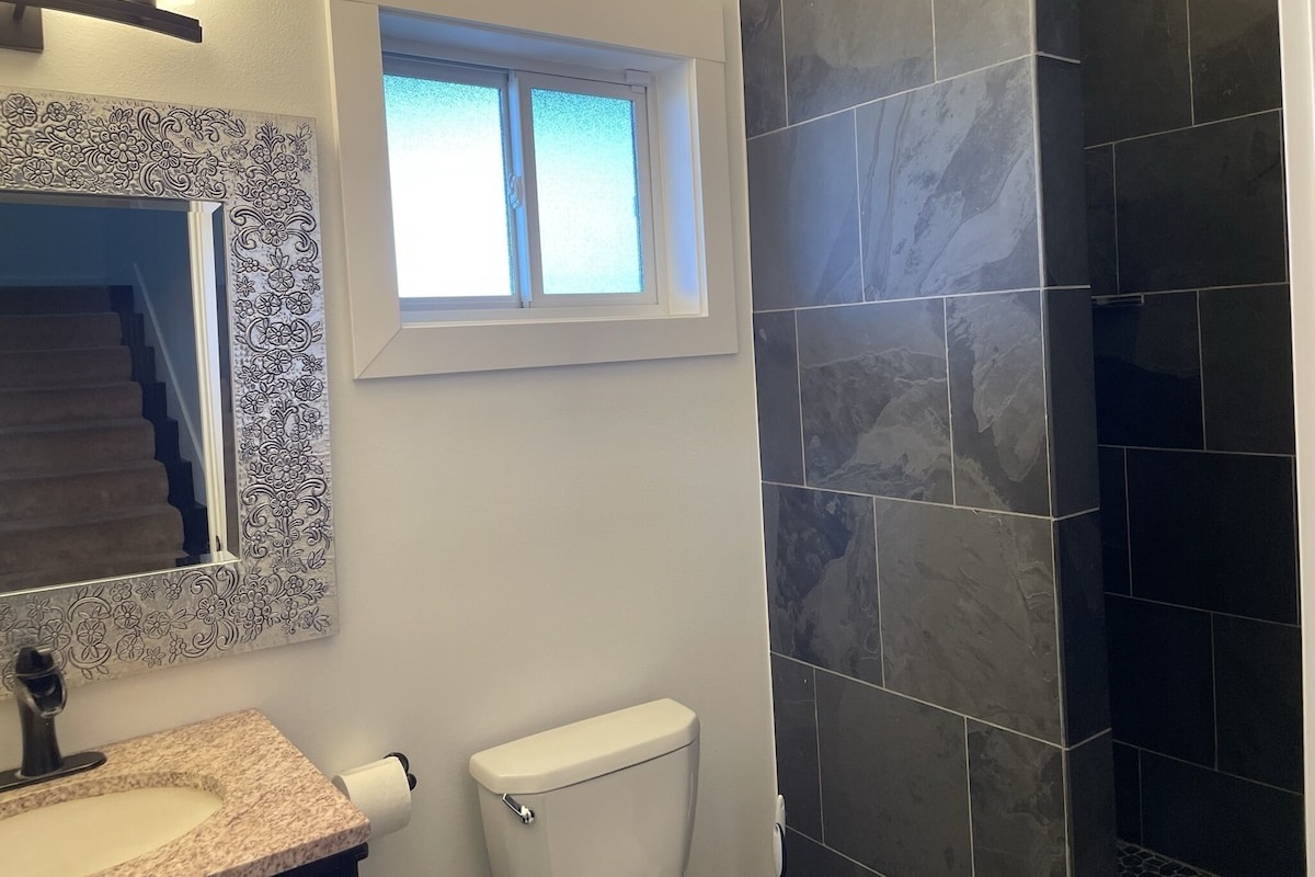 Downstairs full bathroom with custom walk in shower.