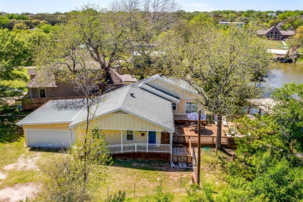 Charming lakefront exterior nestled in a quiet Granbury neighborhood.