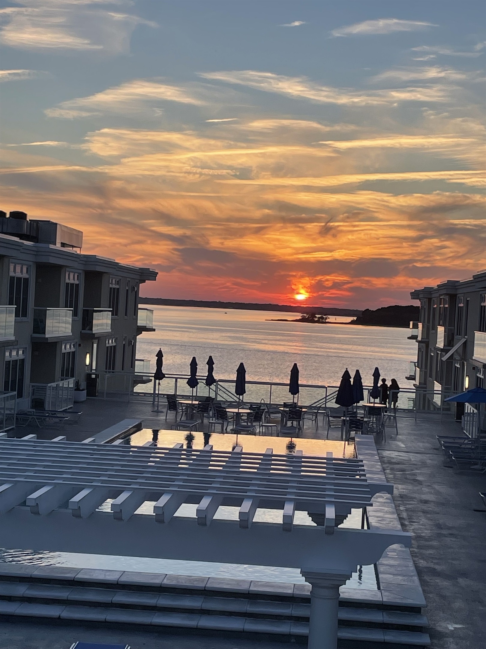 View from roof deck overlooking pool on the bay