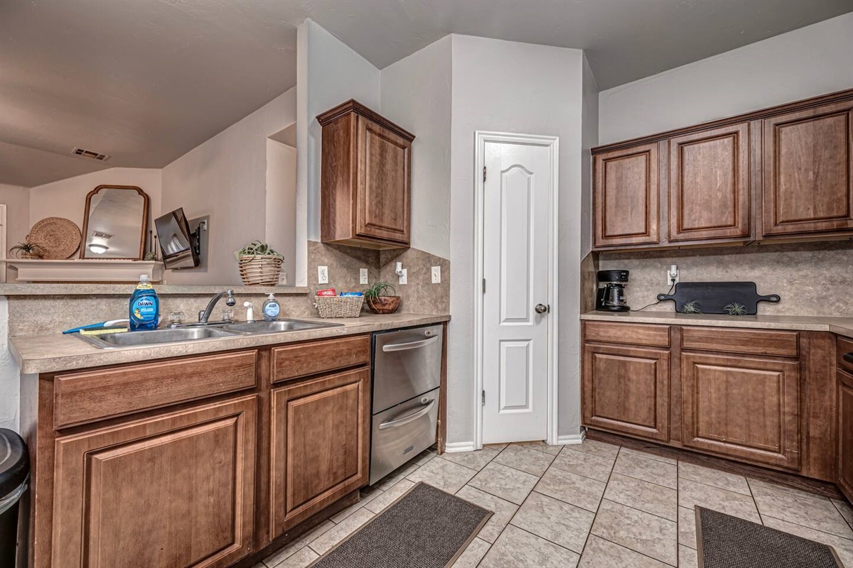 Bright kitchen featuring a cozy table set for four guests.