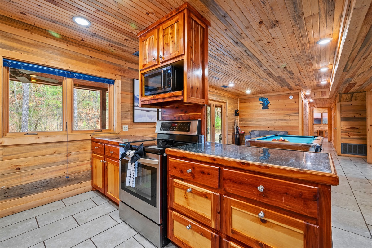 With ample counter space and storage, the kitchen is well equipped for preparing meals for large groups.
