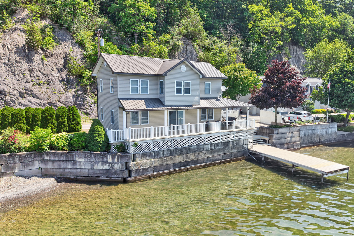 Lake-facing exterior with full-width deck