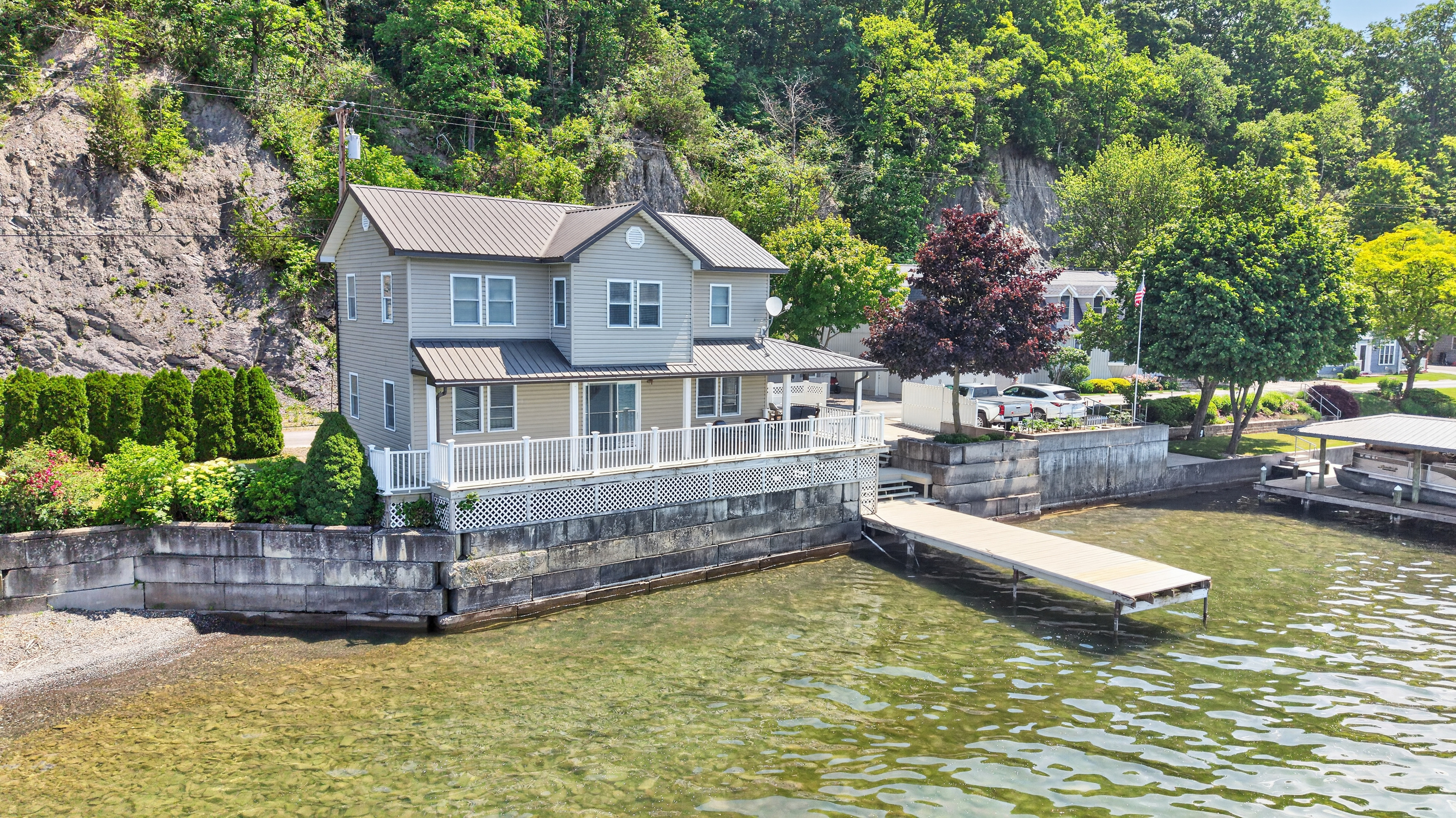 Lake-facing exterior with full-width deck