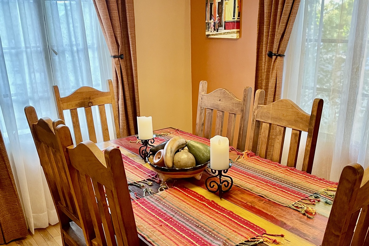 A cozy dining space with a classic wooden table and southwestern accents.