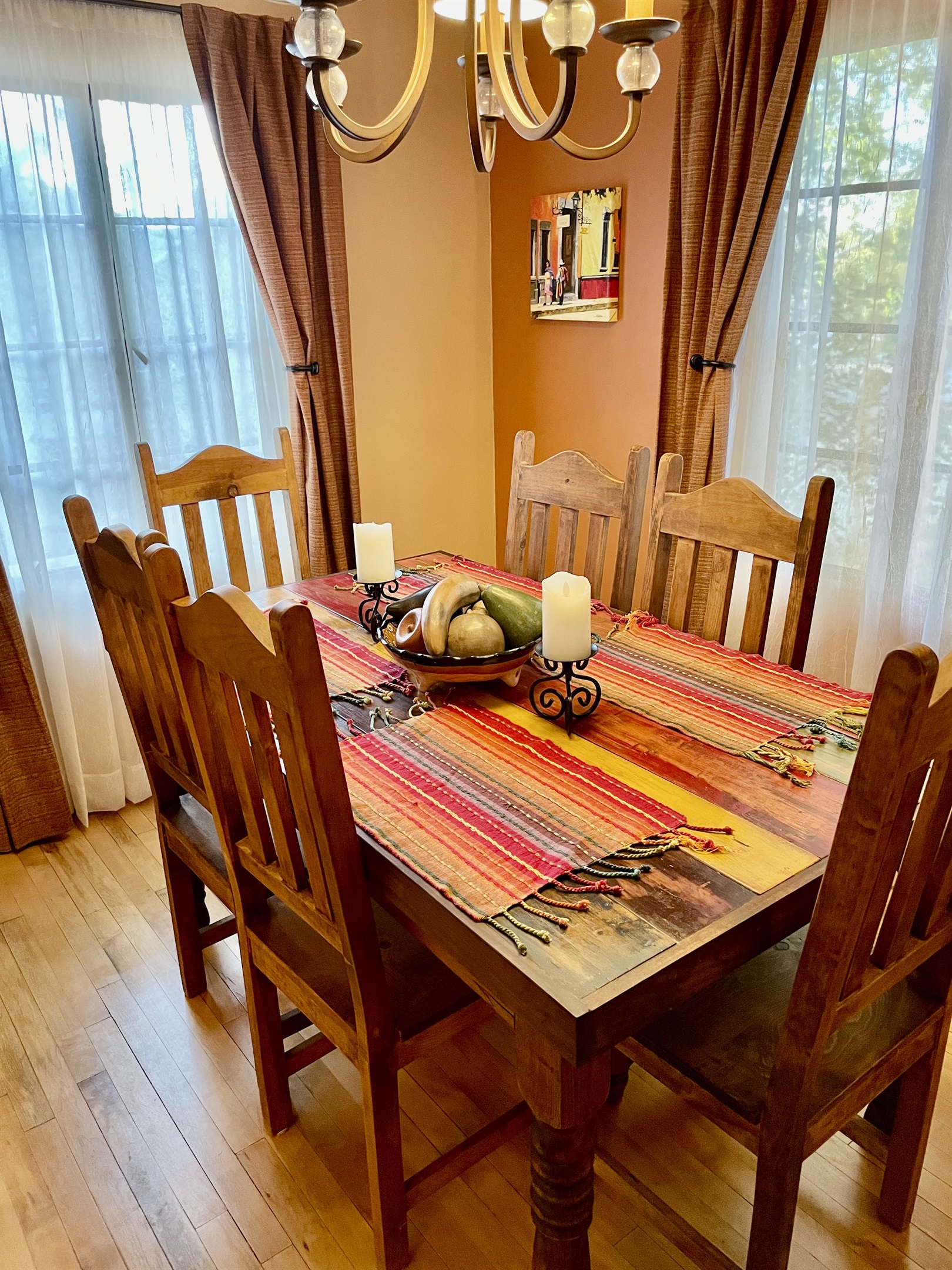 A cozy dining space with a classic wooden table and southwestern accents.