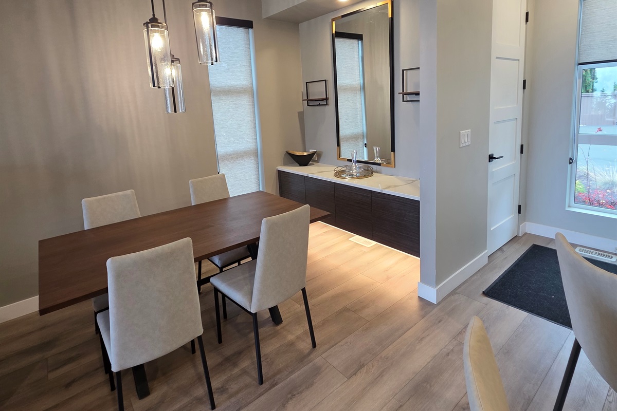 Dining area. Fully stocked with higher end glassware and coffee machine.