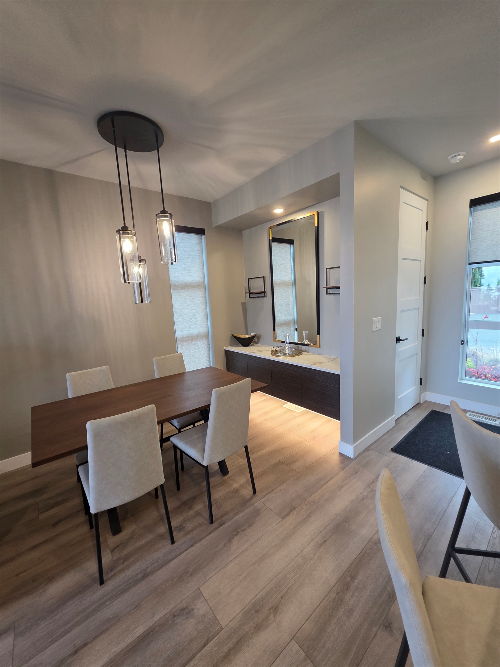 Dining area. Fully stocked with higher end glassware and coffee machine.