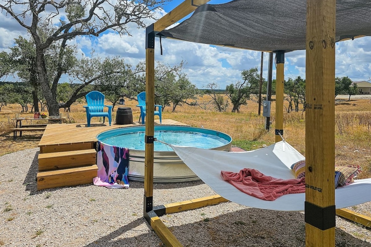 Drift away in the hammock by the pool, where comfort and relaxation meet.