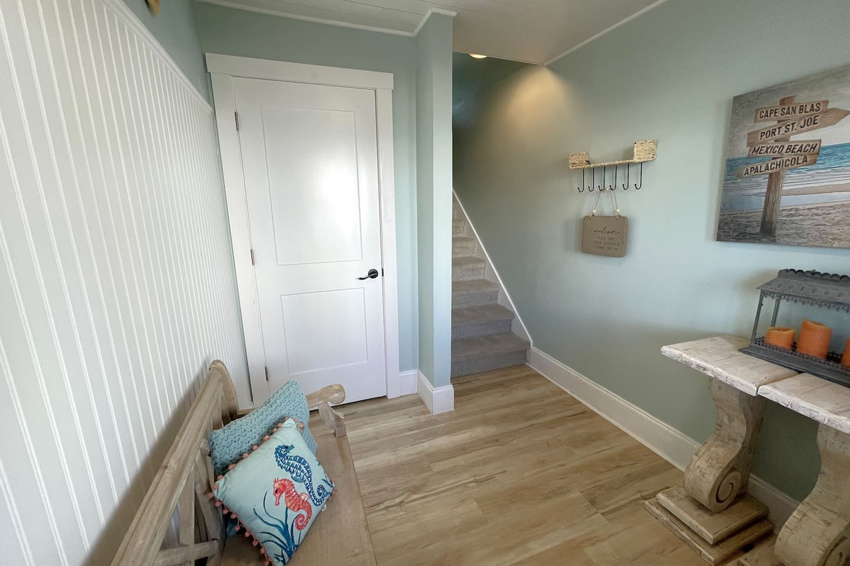 Hooks, Table and Bench Plus Closet in Foyer Entrance