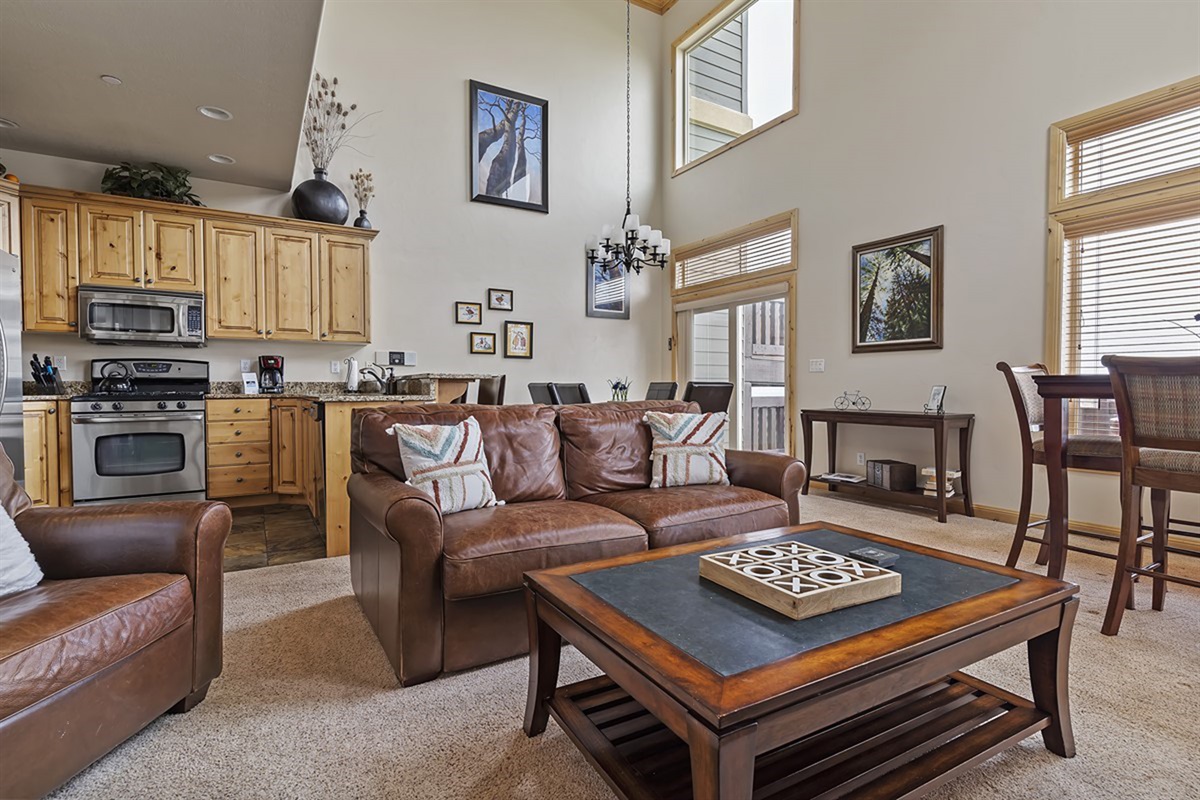 Warm and inviting living area with plush seating and rustic finishes, designed for comfort and connection.