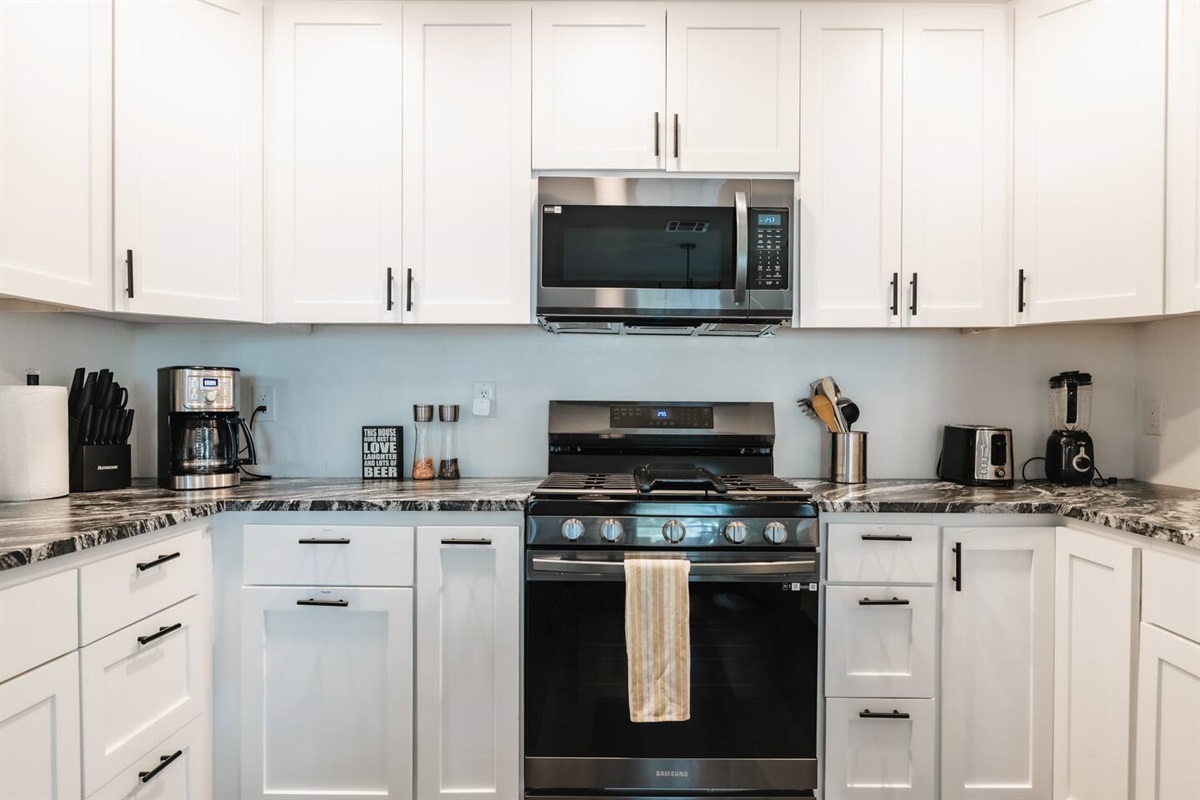new full kitchen with coffee, oven, stove