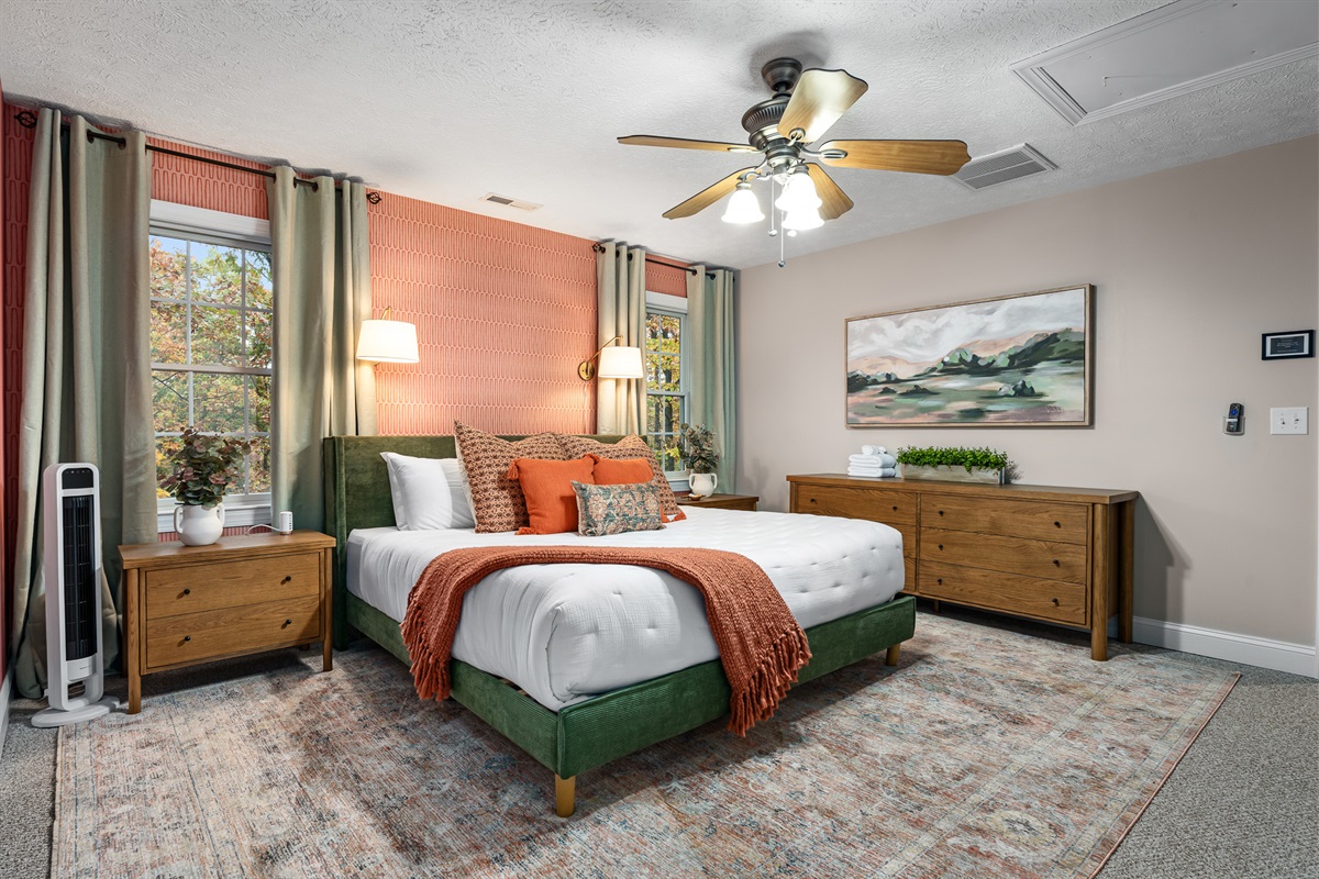 Accented with artwork and plenty of pillows, this king room blends comfort and style.