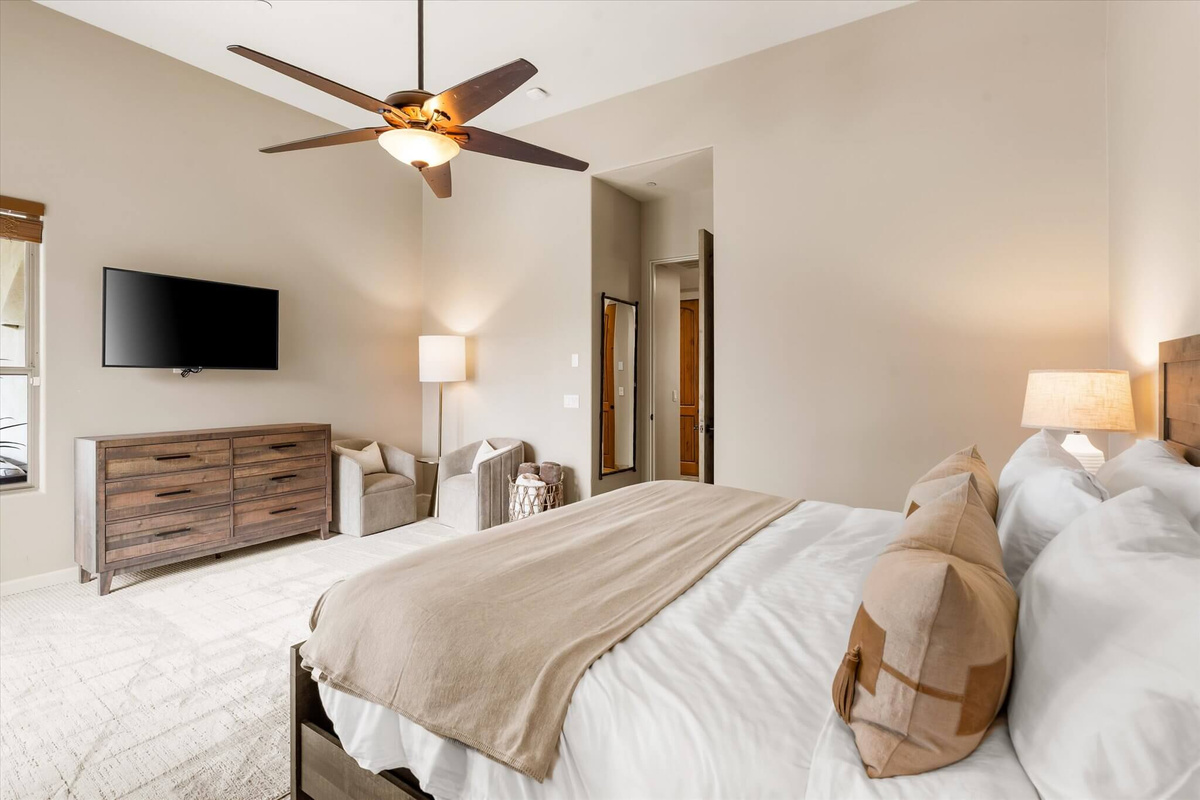 King bed with view of TV and Seating Area