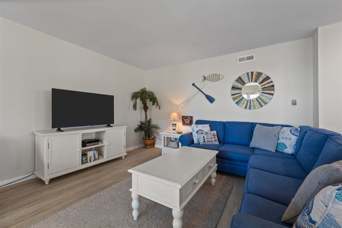 Blue hues and a sleek TV make for the ultimate chill zone