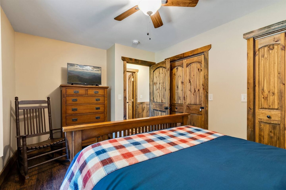 Queen-size bed, TV and Rocker in front bedroom