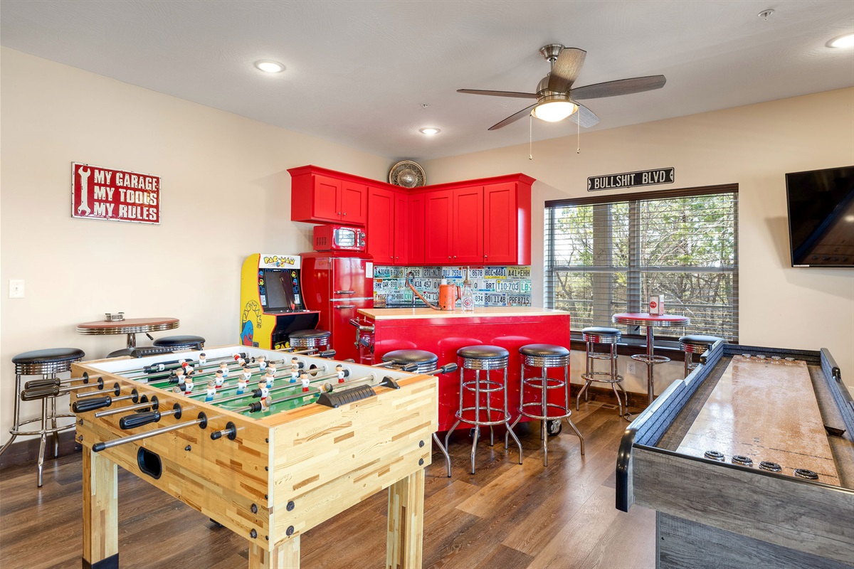 Fooseball, shuffleboard, pac man, claw machine, and pool!!