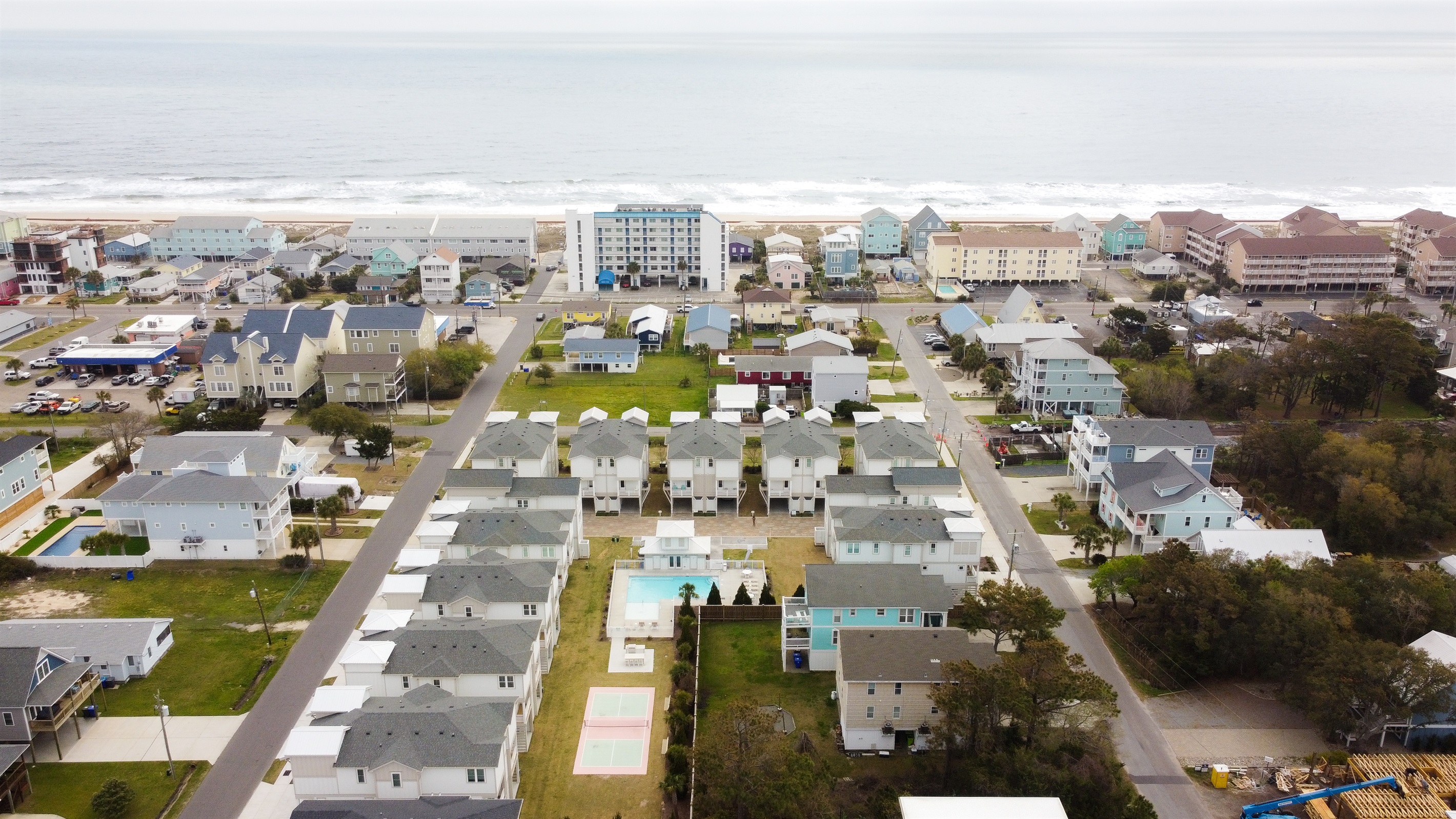Communal pool, grill, and pickle ball court