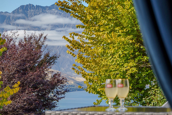The balcony includes a BBQ and outdoor seating, creating a practical fresh-air space just off the dining area.