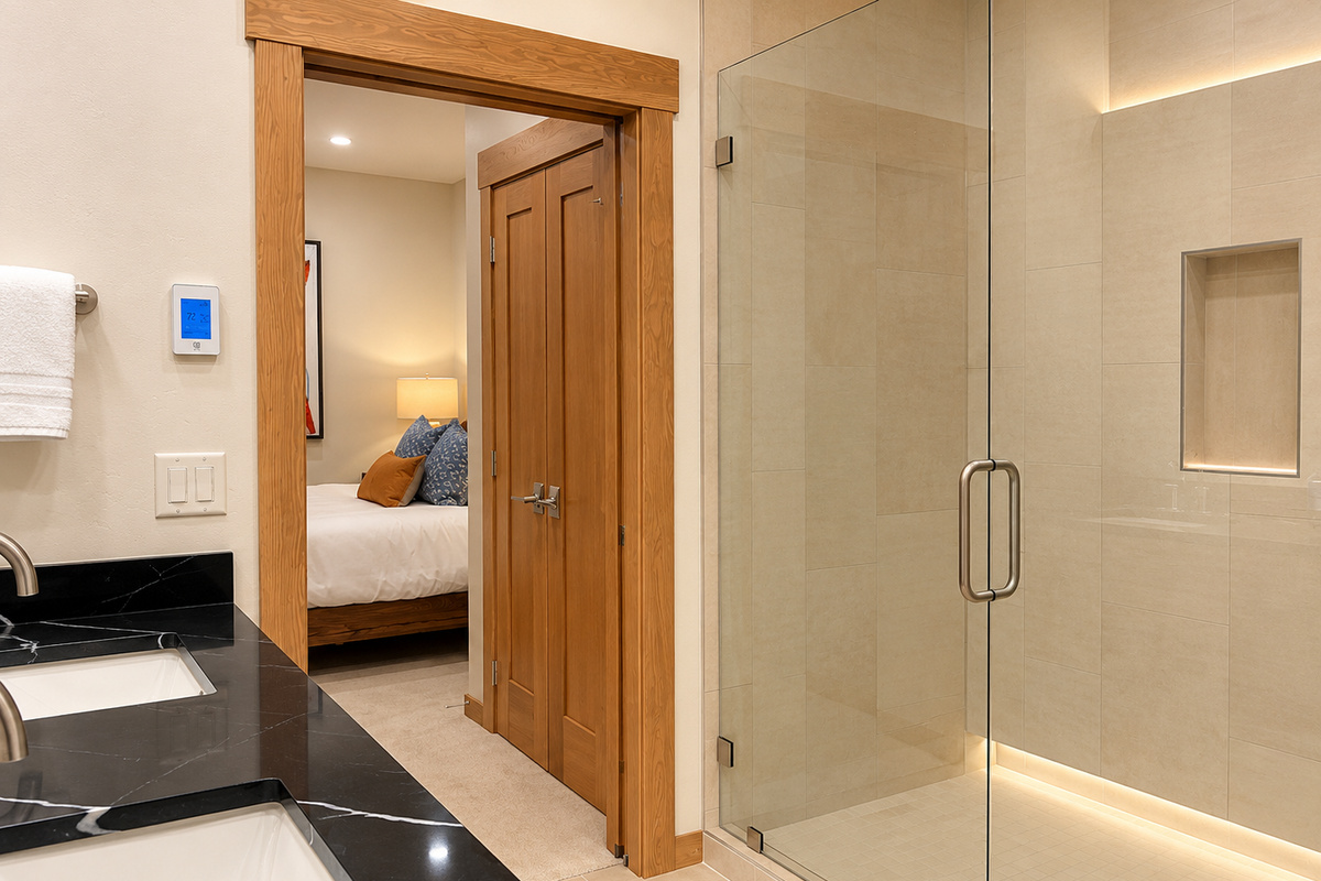 Spacious glass-enclosed walk-in shower.