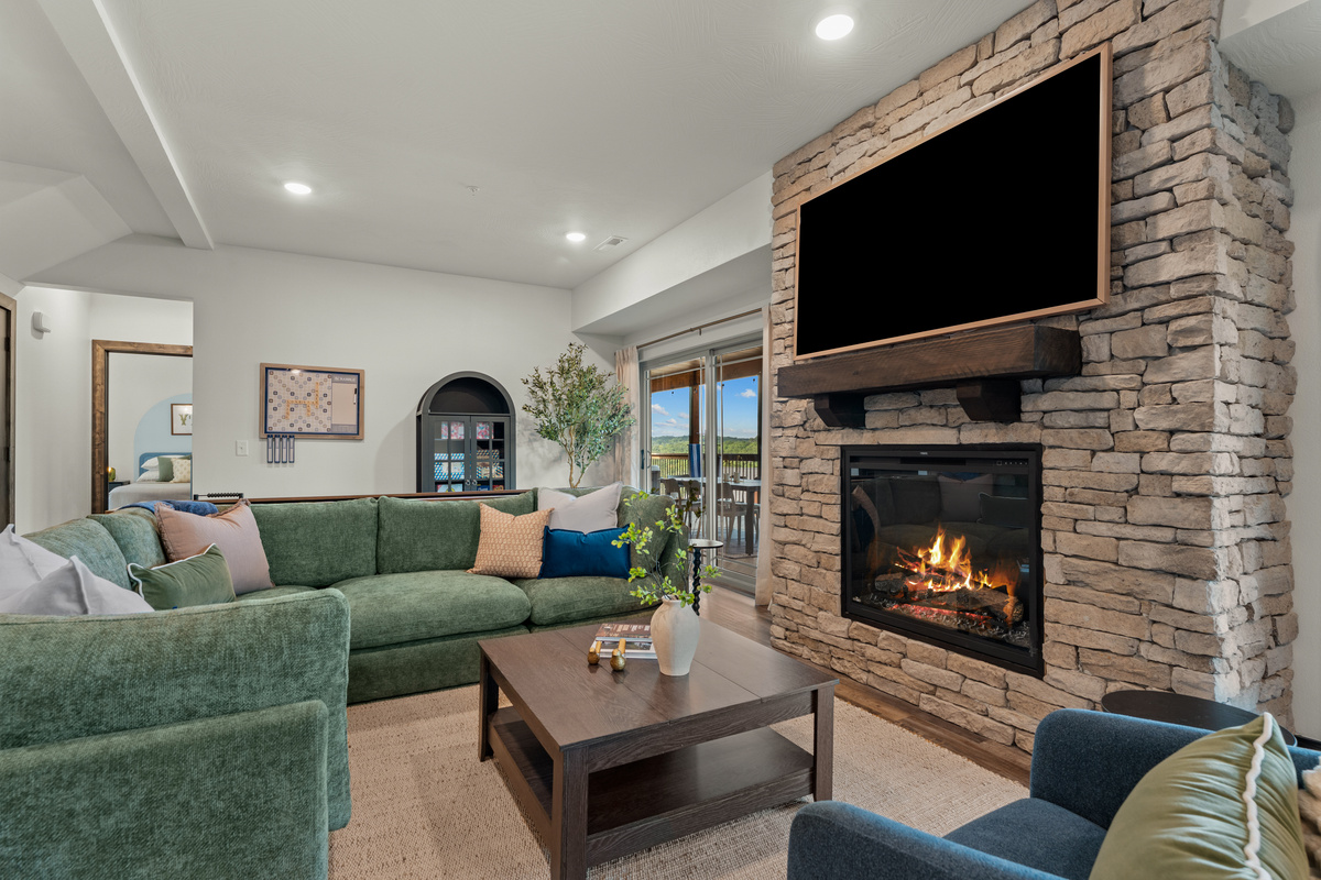 Sink into the living-room sectional for movie night on the Smart TV, deck doors open to the wooded Ozark hills.