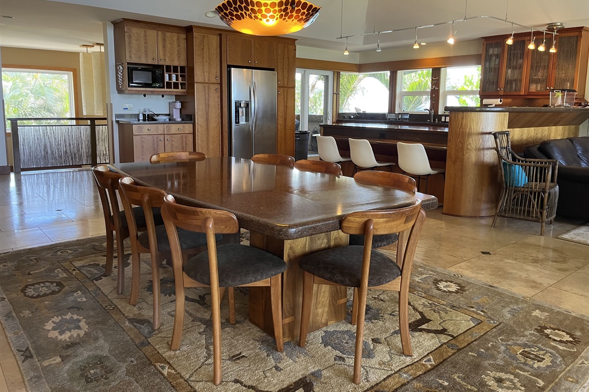 Dining table for 8 plus room for three more at the bar.