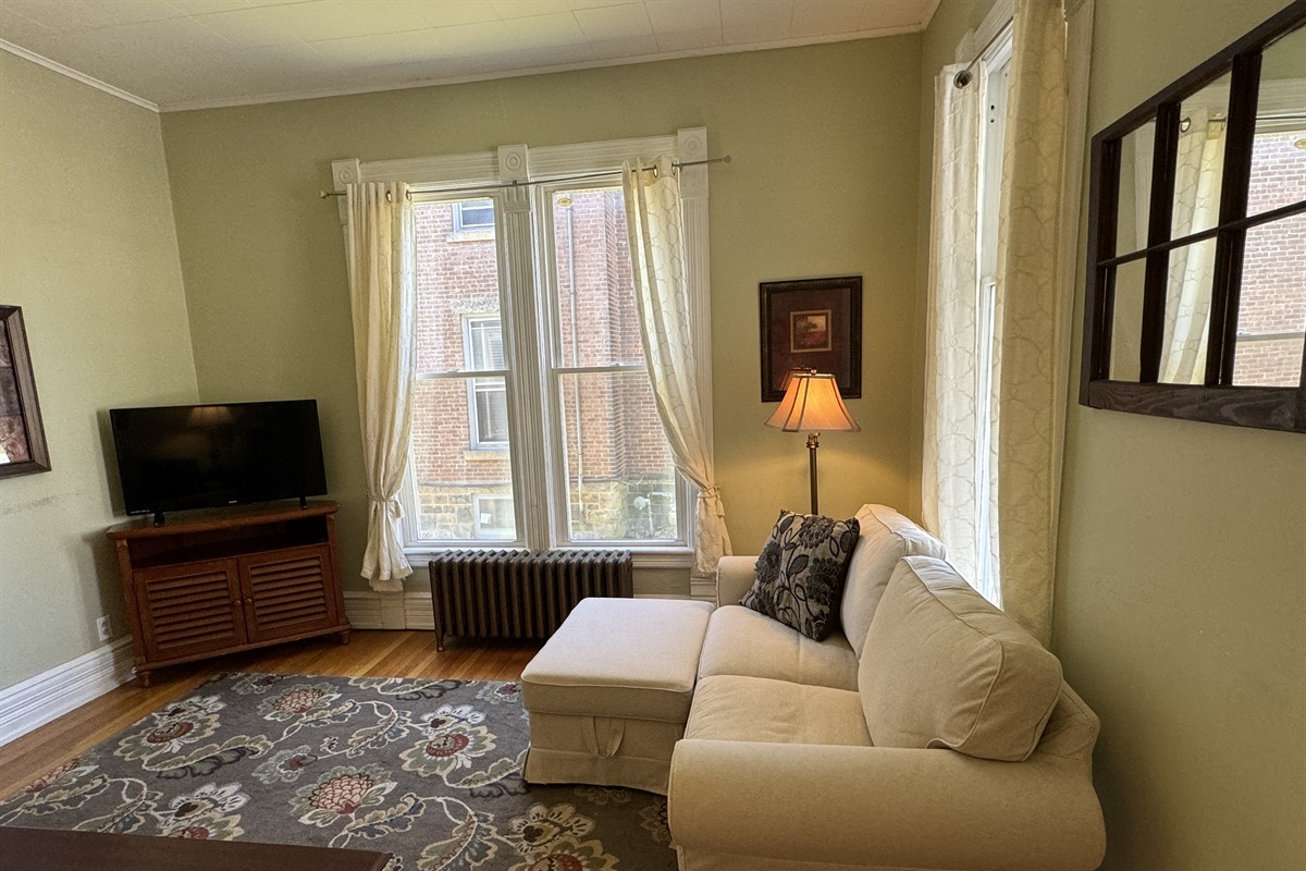 Spacious living room with large windows