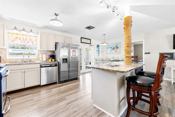 Kitchen with cookware, dishes and utensils for 10!   Kitchen includes coffee, paper towels and starter set of Dishwasher detergent.
