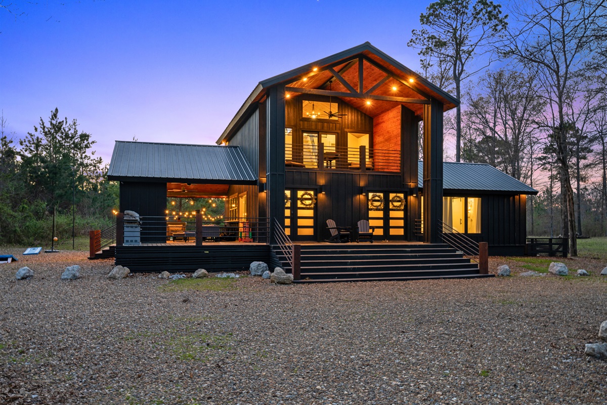 From this angle, you can see how the home sits comfortably within its wooded setting, offering both privacy and scenic views.