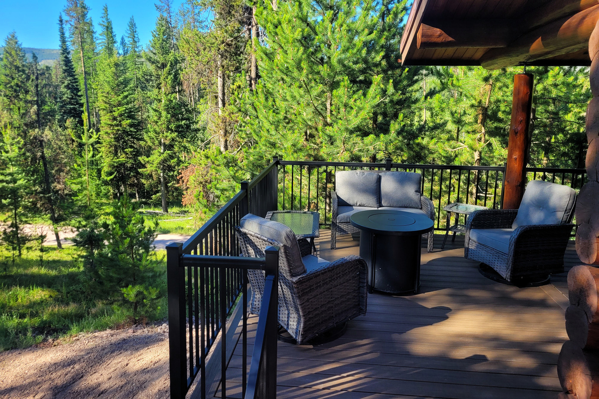 Enjoy dinner on a peaceful deck, centered around a propane firepit for cool evenings.