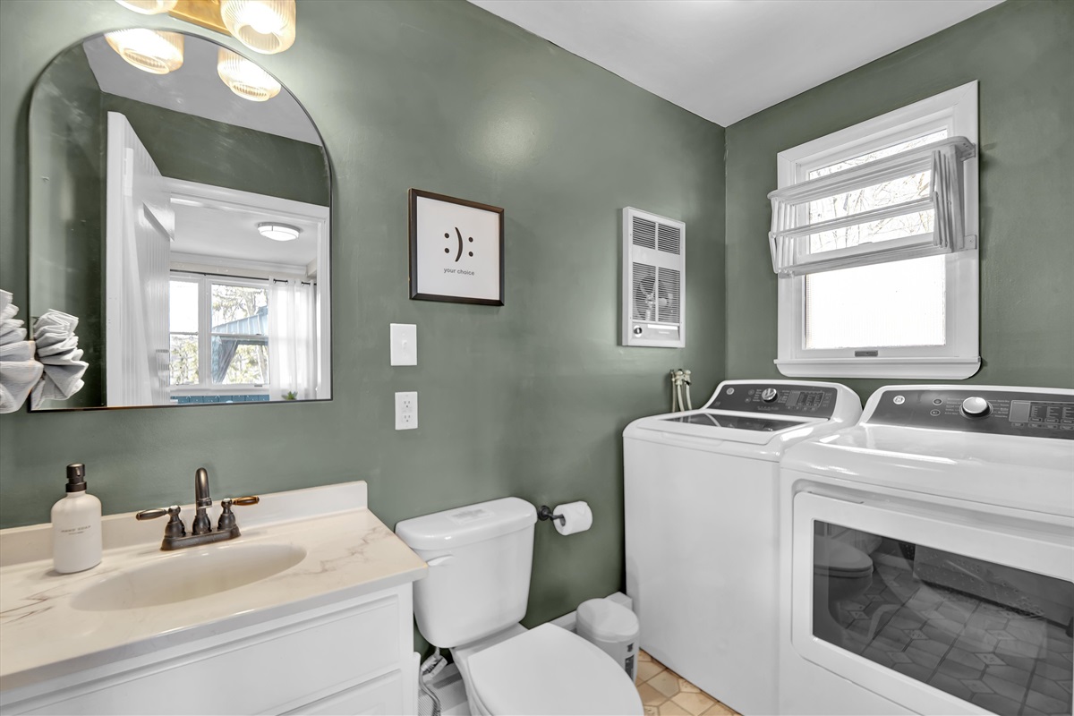 Powder room with laundry.