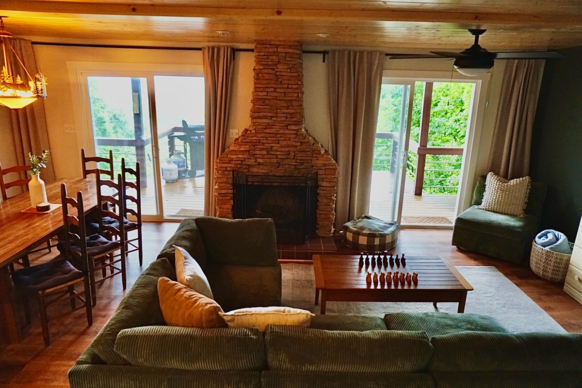 Enjoy stunning views, a warm stone fireplace, and ample seating for gathering fun!