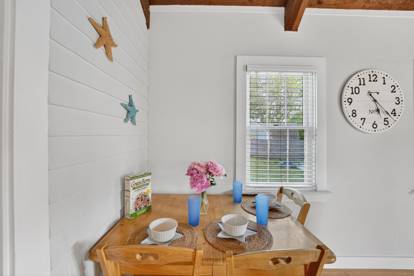 Cozy breakfast nook with seating for two, ideal for casual meals or planning the day's adventures.