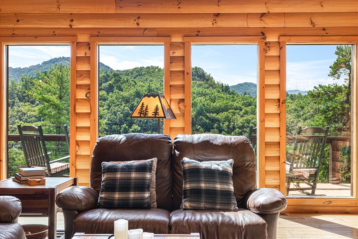 Main Level Living Room: Sweeping mountain views invite relaxation in this rustic haven, complete with stylish decor!