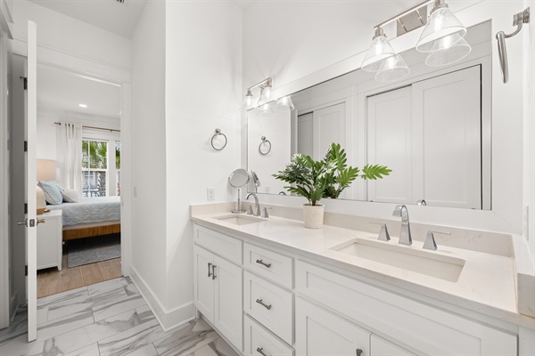 A spacious vanity and functional layout provide plenty of room to get ready for beach days and evenings out.