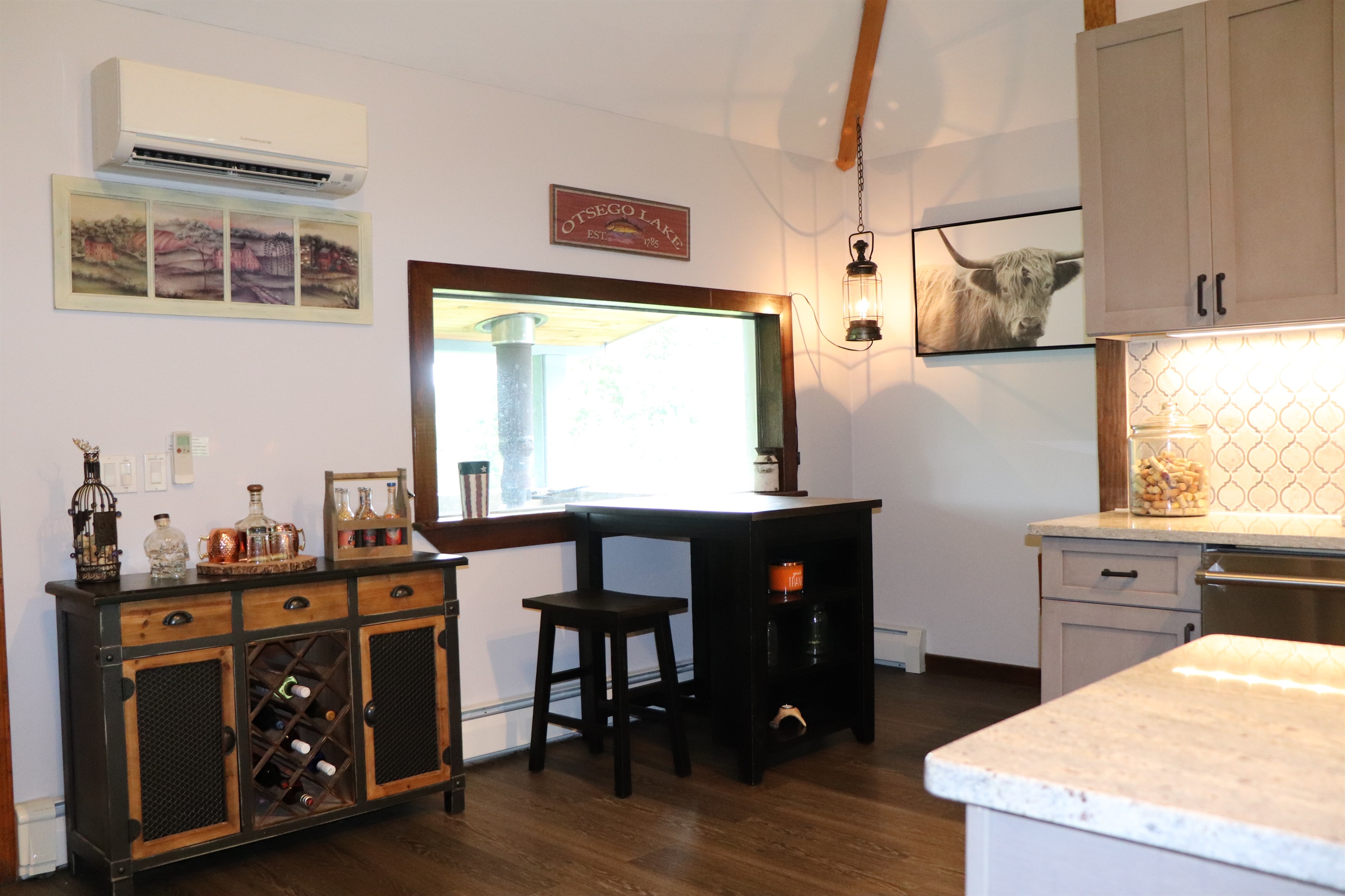 Nestled next to the kitchen is a wonderful bar area, so folks can hang out but not be under foot while you are cooking!