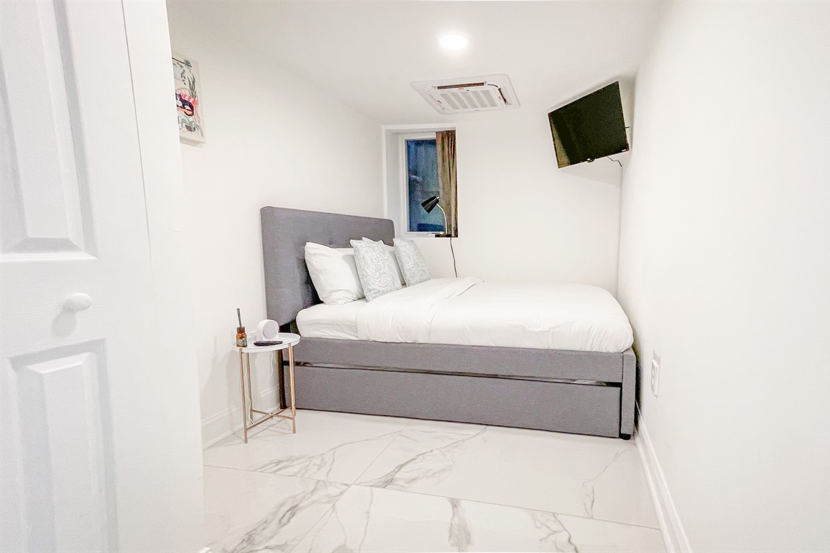 Bedroom #10 on the lower level has a full bed with a twin trundle underneath