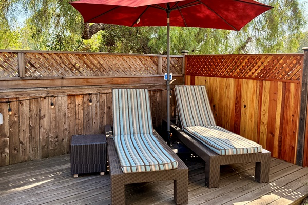 Outdoor deck includes privacy fence, BBQ with tools and propane, 2 chaise lounge chairs, a teak dining table with 4 chairs, and 2 camping rocker chairs (stored in garage).