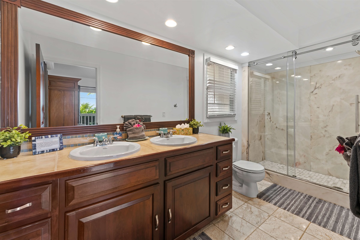 The ensuite bathroom to the second primary suite is spacious and exceptionally clean!